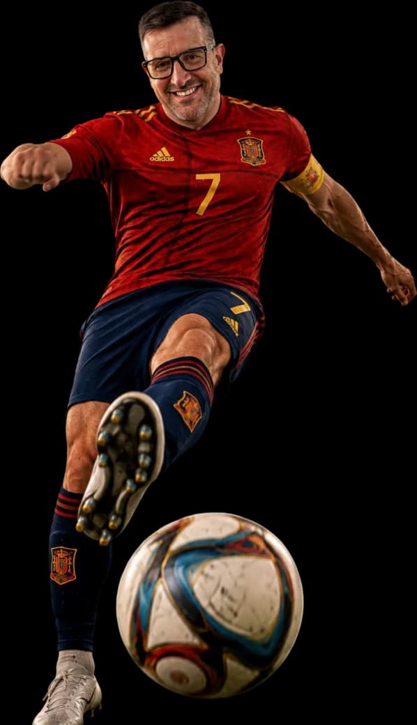 Relevant Audience founder in a Spain shirt striking a football